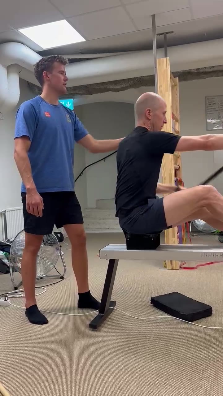 Joakim coaching kayak technique on a land-based ergometer