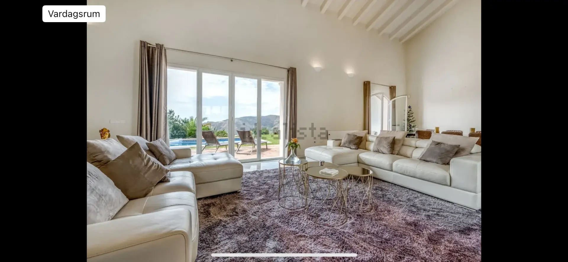 Bright shared living room at the Marbella camp accommodation